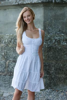 16P Slim teen with blonde hair and a pretty face stands naked after removing dress
