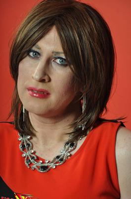 15P A very sultry TGirl showing off her red and black dress