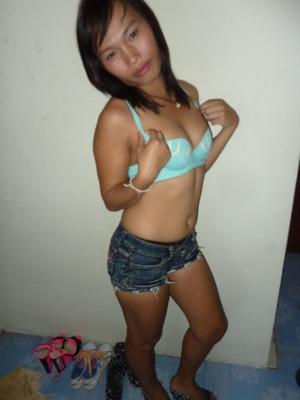 17P Petite Asian shemale Nam strips off to pose nude & tug her teen cock