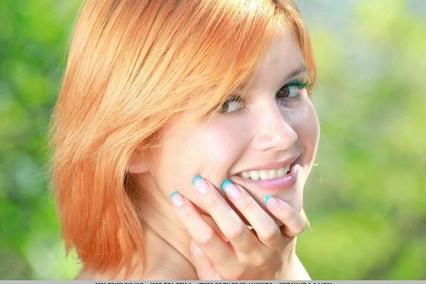18P Beautiful redhead Violla A removes her clothes on a country lane to pose nude