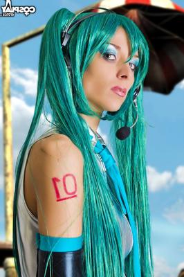 12P Hot girl works her tits and pussy free of a Hatsune Miku cosplay outfit