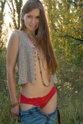 20P Tiny teen Lady Di gets naked in forest clearing before starting to get dressed
