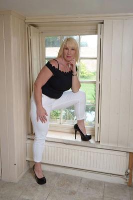 20P Blonde amateur Melody unveils her big natural tits near a window