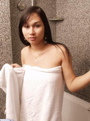 17P Dark haired ladyboy washes up her uncut cock while taking a shower