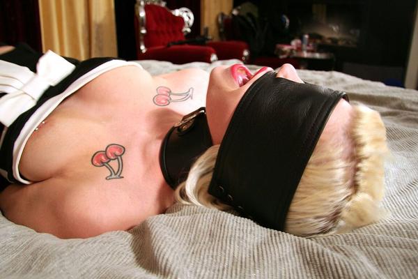 16P Collared and restrained blonde Dizzy Duveaux finds herself blindfolded too