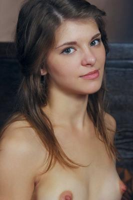 16P Young brunette Berka shows her yummy pussy while going naked on her bed