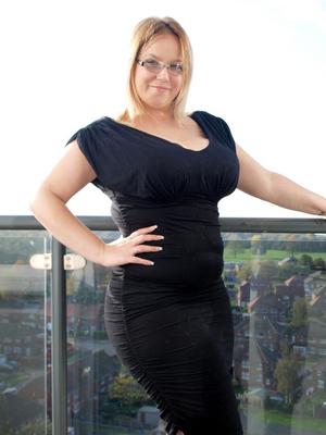 16P Overweight amateur Sindy Bust doffs a black dress while getting naked