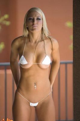 15P Hot slut Megan teases with her round big tits in a very skimpy bikini & heels
