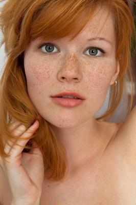 21P Redheaded teen with nice boobs Mia Sollis poses naked in a solo