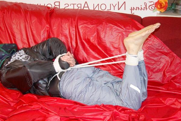 16P Sonja tied and gagged with ropes and a ball gag wearing a sexy grey shiny