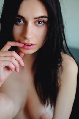 16P Dark haired teen Dita V lays about on a sofa while completely naked