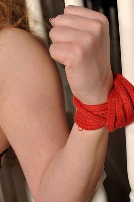 12P Redhead wearing a bodystocking tied up