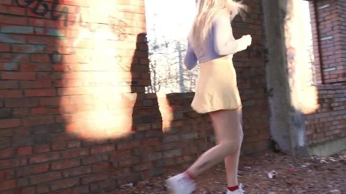 15P Blonde chick squats for a piss by an abandoned brick building