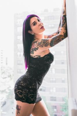 17P Stunning tattooed babe with dyed hair takes off her lingerie and exposes pussy