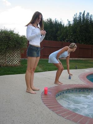 20P Lesbian teens show off their petite bodies in swimwear by the pool