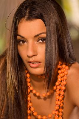 17P Irresistible Latina Jo Garcia poses naked in beads showing her natural tits