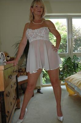 12P Natural blonde Marlen releases her breasts while in her bedroom