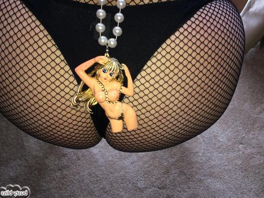 16P Mature woman Busty Bliss models a mesh bodystocking and glasses