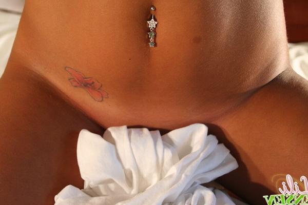 12P Teen amateur Lili Jensen places hands over tits while showing a belly piercing