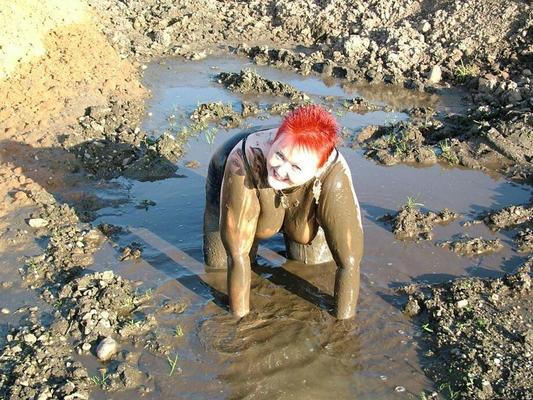 20P Mature redhead Valgasmic Exposed covers her fat body in mud