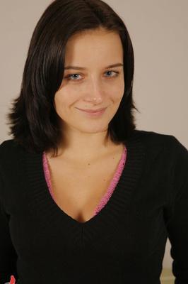 21P Naked brunette Nikol H. opens her legs wide to show her yummy pussy on a chair