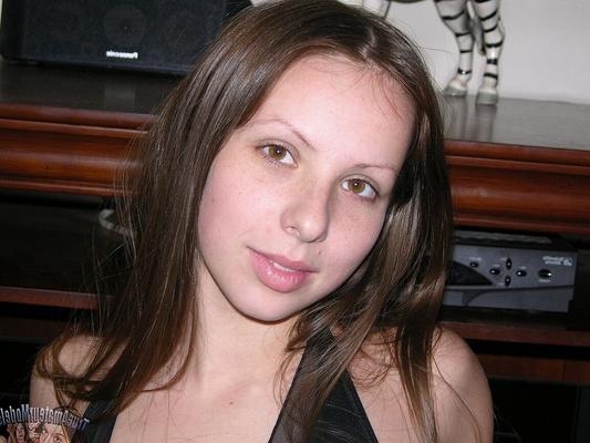 13P Sweet teen shows her shaved pussy while modelling totally naked