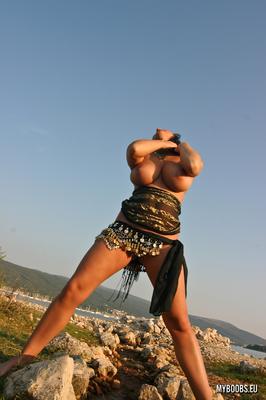 16P Solo girl Kora Kryk flaunts her huge tits next to the ocean