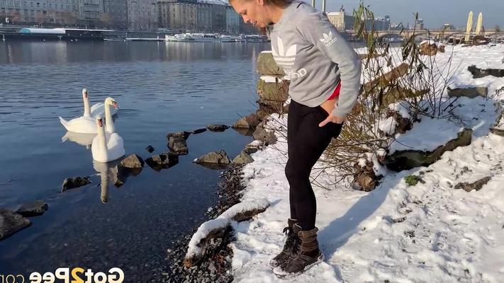 15P European babe squats next to the river to piss