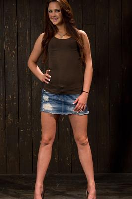 21P Brunette babe Hope Howell gets whipped while chained up in metal bondage