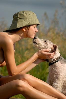12P Skinny girl plays with a dog while modelling naked in a bucket hat