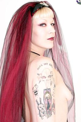 15P Tattooed girl with long red hair loves guns