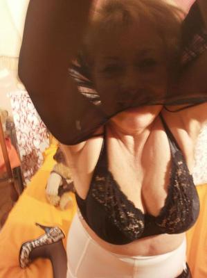 20P Older blonde woman Caro shows her hairy twat in lingerie and nylons on bed