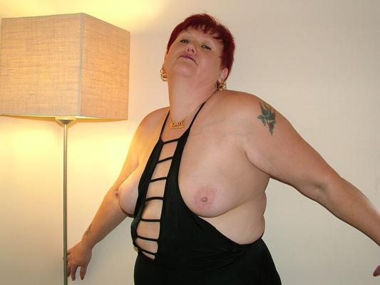 20P Overweight aged redhead Valgasmic Exposed models a revealing dress in hosiery