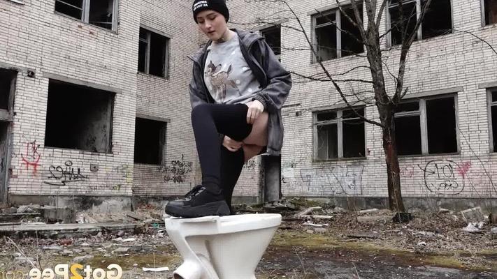 15P Short taken girl Alexa pisses atop a toilet outside of an abandoned building