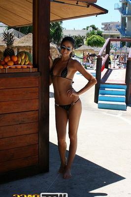 16P Amateur chick Nessa models a bikini in a pool before going naked on a balcony