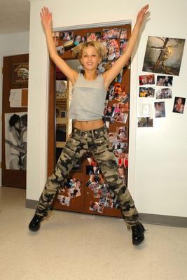 12P Blonde teen pulls down camo pants before having her tight ass flogged