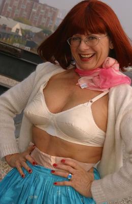 12P Older lady Miss Abigail uncovers small tits after flashing vintage lingerie