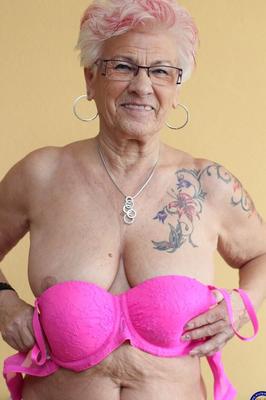 21P German granny Gerdi strips & spreads her sweet shaved old pussy on a bed