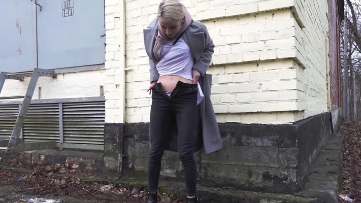 15P Blonde girl Masha pulls down her pants take a pee on a sidewalk on a wet day
