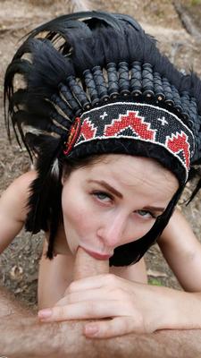12P Naked gf Cassie Fire wears a headdress during a POV blowjob in the woods