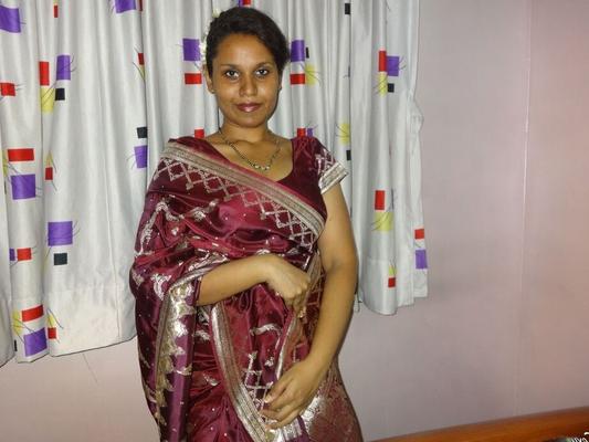 16P Clothed Indian woman strips to her black bra and underskirt