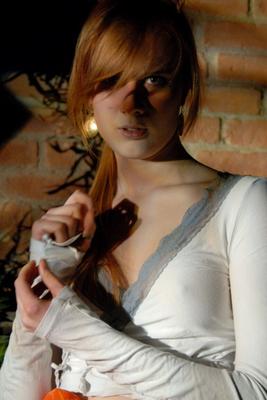 12P Natural redhead Lina plays with her ponytail while exposing her upskirt undies