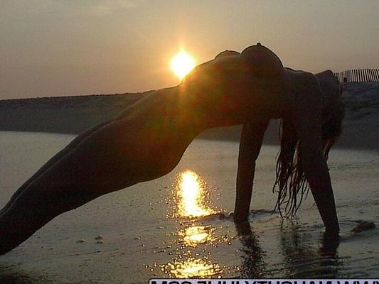 16P Blonde amateur Naughty Julie removes mesh attire for great nude poses in surf