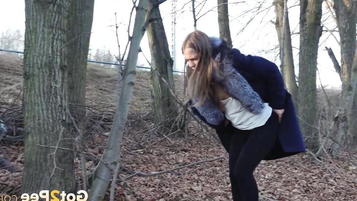 15P Short taken girl pulls down tights to take a pee while walking thru the woods