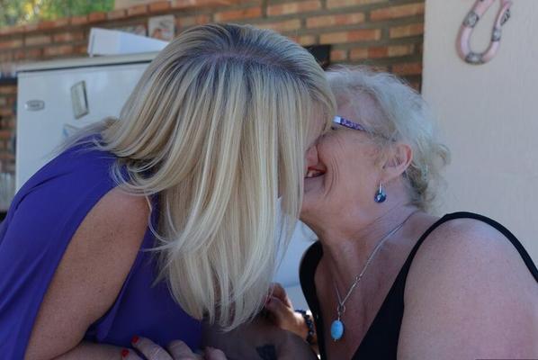 20P Old women share a lesbian kiss after drinking to much wine out on the patio