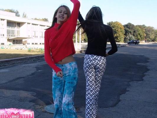 10P Young lesbians Laura and Katrina kiss on the lips while fully clothed