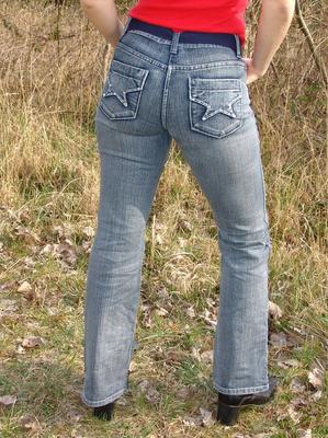 20P Curvy blonde Sweet Susi pulls out a smoke after getting naked in woods