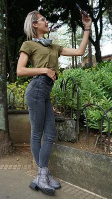 16P Veronica Leal posing all over her hood in green shirt and tight jeans