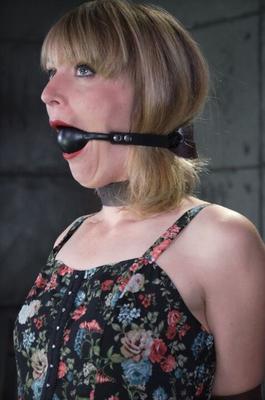 16P Clothed female Mona Wales finds herself being restrained in a dungeon