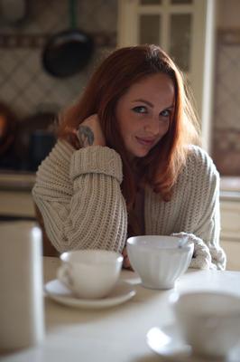 12P UK redhead Kara Carter rubs cream into her big natural tits in the kitchen